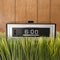 Retro alarm clock in grass