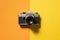 Retro analogue camera. Vintage old fashioned camera with lens on two colored background