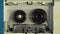Retro audio cassette with magnetic tape in analog audio player