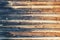 Retro background of boards logs burned on one side. Old wooden background