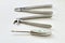 Retro. Black and white photography. Metal dental instruments for removing teeth on sterile white gauze background