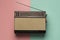 Retro broadcast radio receiver pink light blue background . High quality and resolution beautiful photo concept