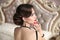 Retro brunette with red lips hollywood makeup, fashion jewelry,