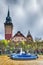 Retro building of city hall in Subotica city and blue fountain, Serbia