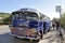 A retro bus stands at the bus stop