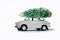 Retro car with christmas tree. Unusual christmas illustration