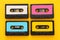 Retro cassette tape collection over yellow wooden table. top view. copy space