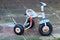 Retro child tricycle bike on the pavement