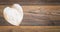 Retro classic Valentine`s Day cad, large white painted wooden hart isolated and on left side with large copy space on vintage oak