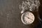 Retro Clock and white flower lying on rusted table