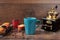 Retro coffee grinder, coffee mill coffee cup, chocolate cupcake, muffins, coffee beans. Wood backg
