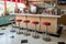 retro diner counter with stools and milkshakes