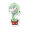 retro distressed sticker of a cartoon carnivorous plant