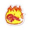 retro distressed sticker of a cartoon flaming dragon