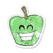 retro distressed sticker of a cartoon grinning apple