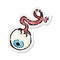 retro distressed sticker of a cartoon gross eyeball