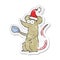 retro distressed sticker of a cartoon mouse wearing christmas hat