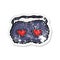 retro distressed sticker of a cartoon sleeping mask with love hearts