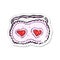 retro distressed sticker of a cartoon sleeping mask with love hearts