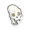 retro distressed sticker of a cartoon spooky vampire skull