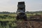 Retro dump truck on a quarry with a raised body