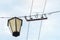 Retro electric street lamp with wires on cloud