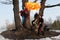 Retro fire-eater showing fire-show on forest
