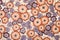 Retro floral pattern. Purple and brown flowers print as background.
