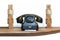 Retro landline telephone on wooden shelf