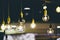 Retro light bulbs hanging in department store, with decorate interior luxury, fixtures combine beautiful modernity Designer, lamps