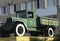 Retro lorry truck. Green color, down side. Body, silver exhaust pipe, car wheel