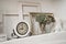 Retro mechanical clock on shelf and decor flowers