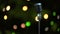 Retro metallic microphone against colorful spots of light against green background