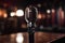 Retro microphone on a stand in a recording studio, close-up