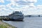 Retro motor ship cruise. River pier Kostroma city. The Volga River. A golden ring. Blue sky