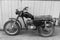 Retro motorcycle. Black and white photo. Old vintage card.