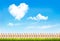 Retro nature background with blue sky with hearts shape clouds.