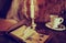 Retro objects feather and leaher book with candle light