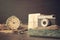 Retro old camera with pile of photos, letters, malachite box and