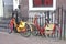 Retro painted students bikes along canal houses, Leiden, Netherlands