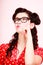 Retro. Pensive thoughtful pinup girl in eyeglasses