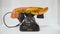 Retro phone with unusual handset. Action. Black retro phone with crab shaped handset stands on white Museum window