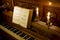 Retro piano with candle light