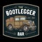 Retro pickup truck with wood barrel. Bootlegger lettering. Vintage engraving