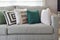 Retro pillows on the cozy grey sofa