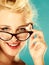 Retro pin up woman wearing eyeglasses.