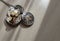 A retro pocket watch and Old vintage iron padlock that have light through on white background