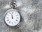 retro pocket watch on silver textile background