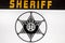 Retro police car, sheriff star sign on the door