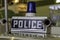 Retro police car sign and vintage siren 1980s UK